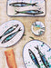Platten und Teller mit Fisch Motiv 
